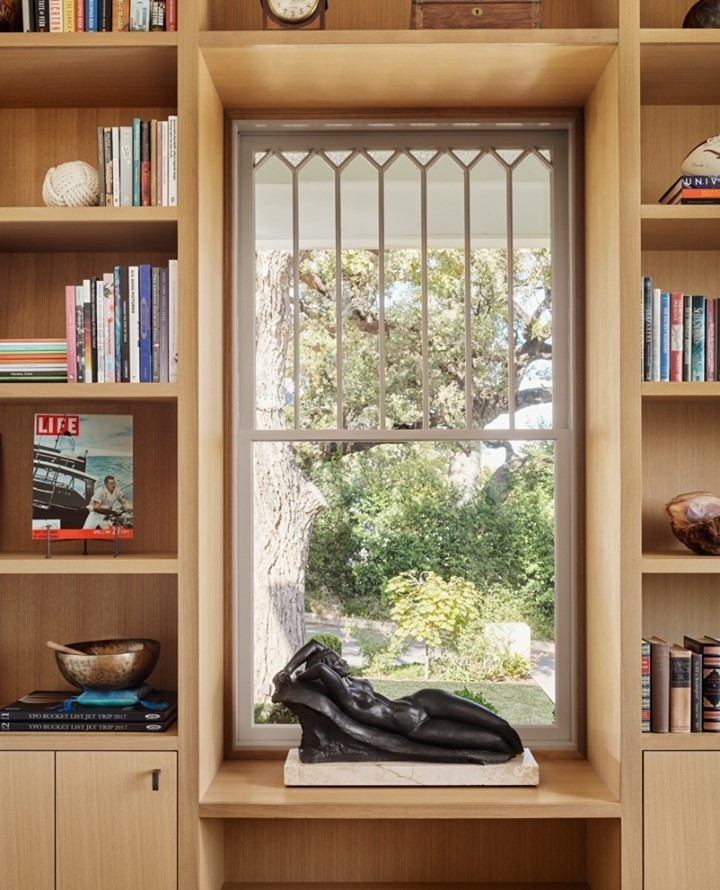 Bookshelves work well to frame this garden view
